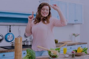 Woman dancing in kitchen