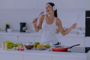 Woman singing in kitchen